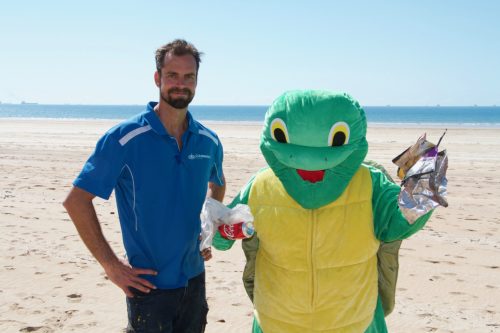 Aaron Horsey and the Reef Catchments mascot, Theo the Turtle.