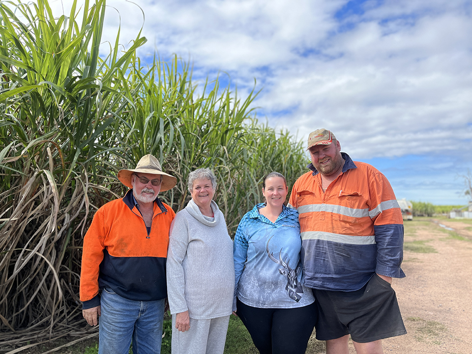 The Hackett family of Koumala, standing in front of cane fields.