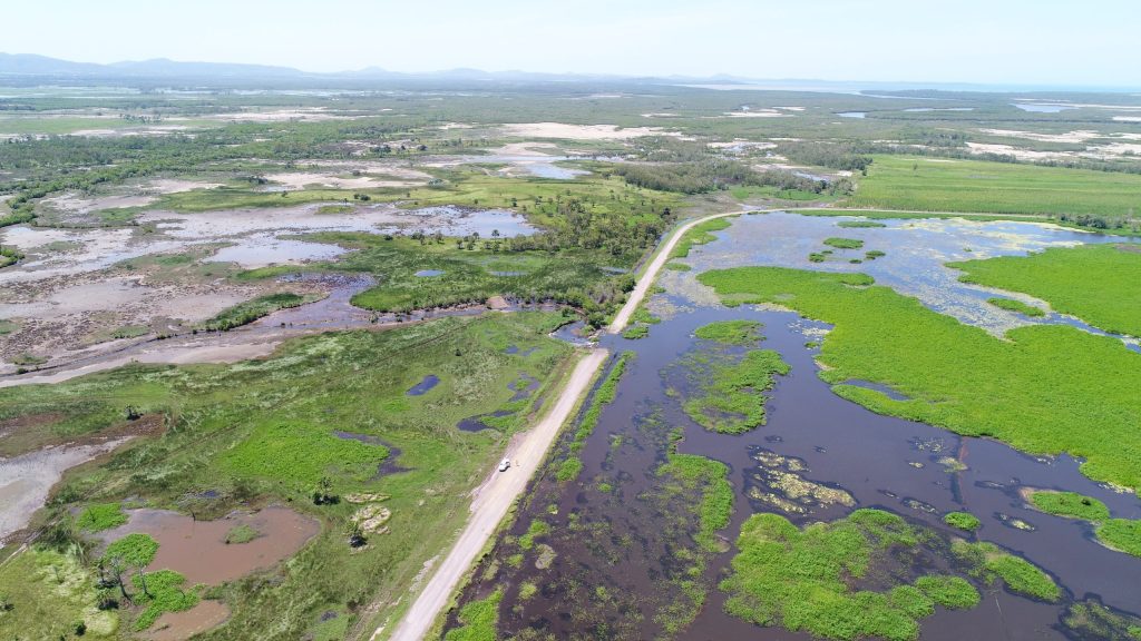 An aerial view of wetlands either side of Landing Road.